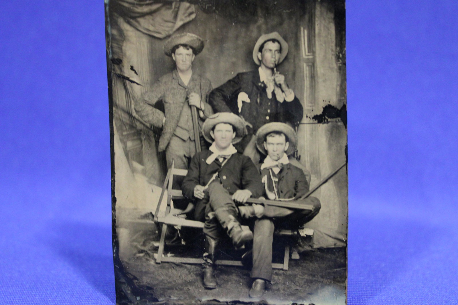 1850-70s Tintype of Cowboys w/ Guns & Powder Horns: 1850-70s Tintype 4 Western-type Cowboys / Militia With Rifles / Guns & Powder Horns - men sporting round possibly straw hats, 2 1/2 x 3 1/2.