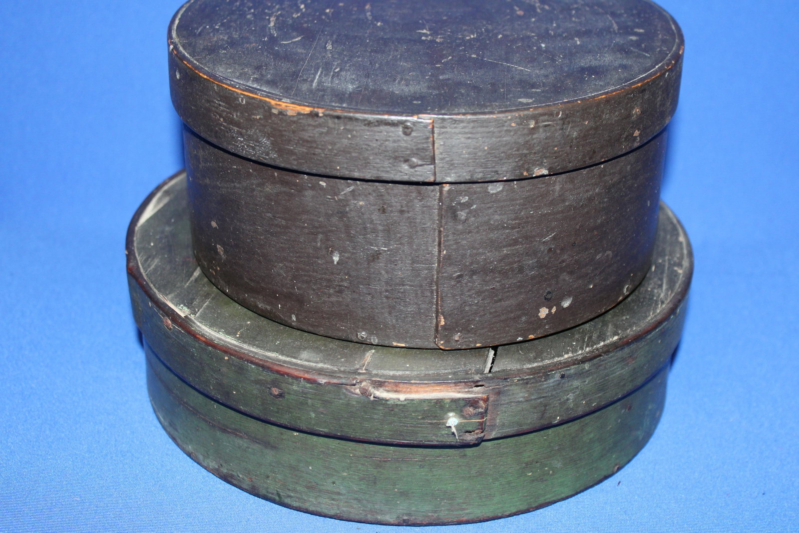 Early Dark Painted Bentwood Pantry Boxes: Early Dark Painted Bentwood Pantry Boxes - largest in old dark green paint; 10 1/2" W x 3" H, crack in lid, chips; measures 8 3/4" W x 4" H