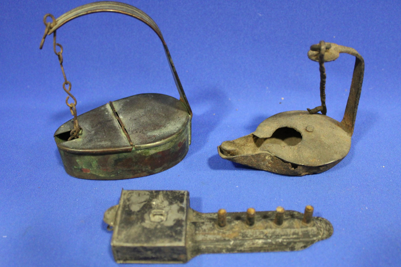 Early Lighting - Betty Lamps & 4-Tube Tin Piggin Lamp: Early Lighting Betty Lamps & 4-Tube Tin Piggin Lamp - 1) copper, 5" H; 2) forged iron, 4" H; rare tin piggin lamp with 4 tubes, 5 1/2" L.