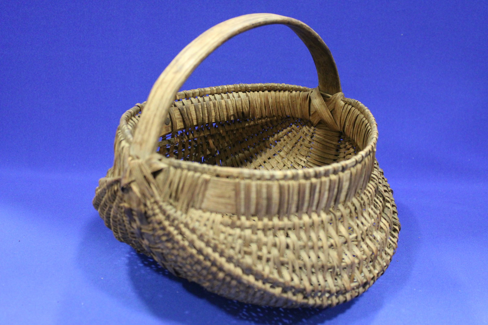 Antique God's Eye Oak Splint Buttocks Basket: Antique God's Eye Oak Splint Buttocks Basket - 9" W x 10" H.