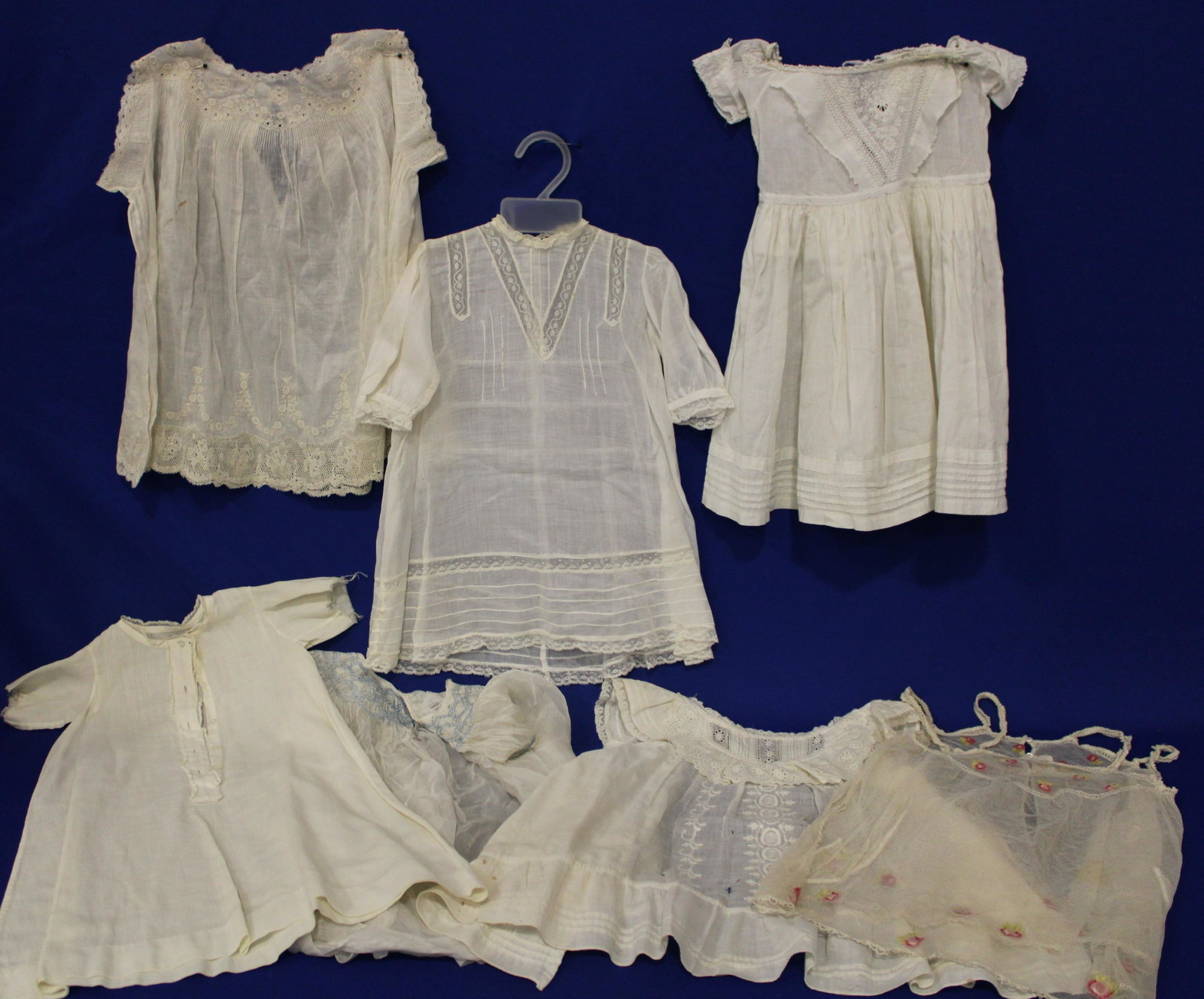 Lot of 5 Small / Toddler / Child's White Dresses inc Paris Label: Lot of 5 Small / Toddler / Child's White Dresses - one labeled Fairyland Paris (2 small brown spots), various fabrics and sizes, longest 22". All clean and good condition.