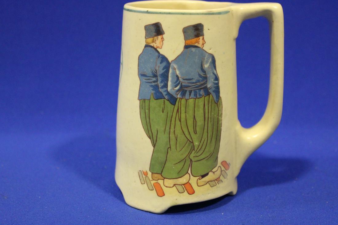 Early 1900s Roseville Creamware Mug Wooden Shoe Ad: Early 1900s Roseville Creamware Mug Wooden Shoe Ad - "The Right Shoe" with two Dutch men, 5 1/4" H.