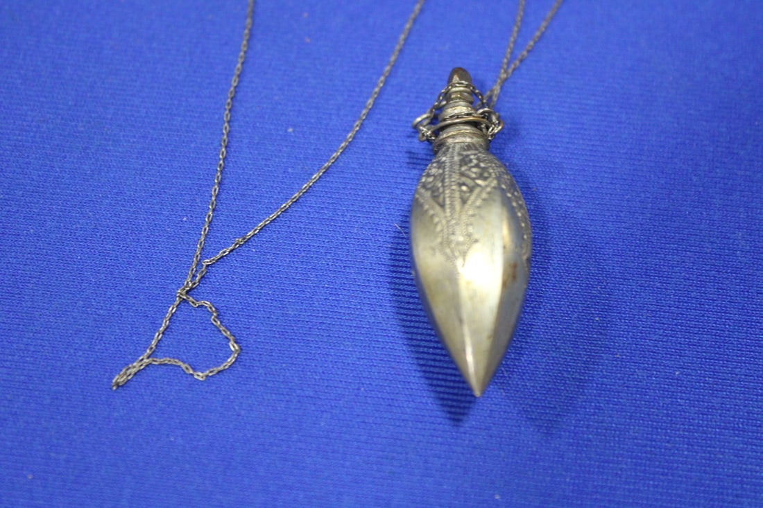 19th C Victorian / Edwardian Perfume Pendant on Chain: 19th C Victorian / Edwardian Perfume Pendant on Chain Jewelry - 30" chain, original dipper, hand-chased designs, nickel silver, unmarked. Note: None of the estate jewelry has been tested for metal con