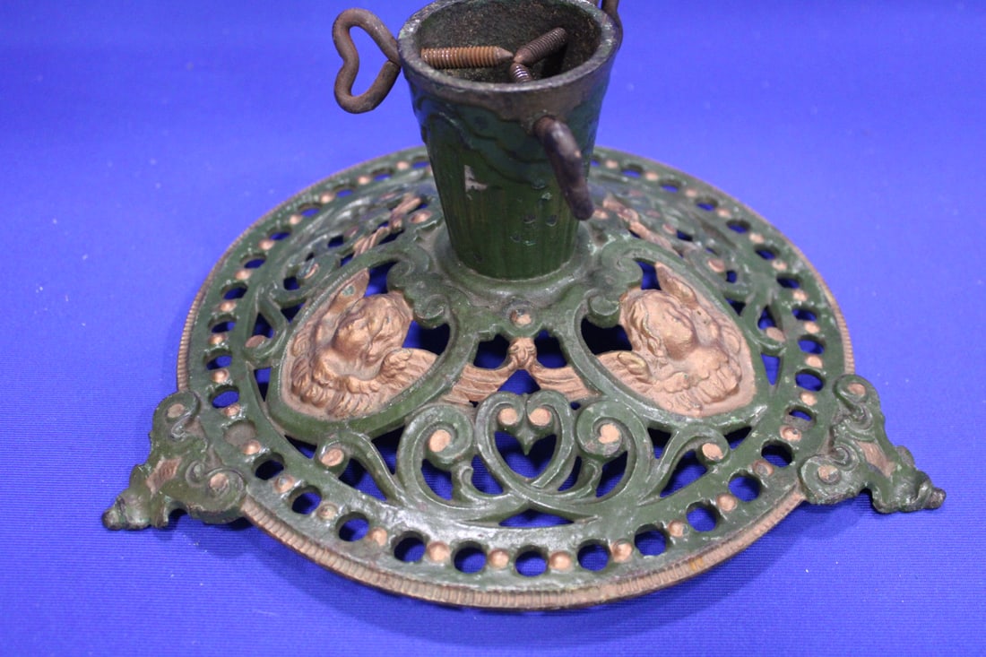 Cast Iron Christmas Tree Stand w/ Angels: Cast Iron Christmas Tree Stand w/ Angels - heart thumb turns, green with gold angel heads, 11 1/2" wide.