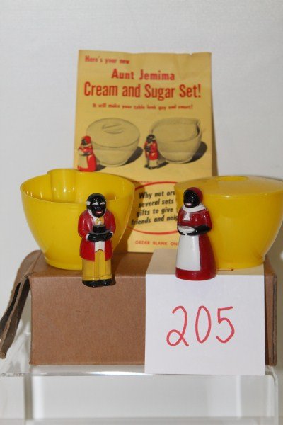 Black Americana Black Faced Aunt Jemima & Uncle M: Black Americana Black Faced Aunt Jemima F&F Plastic Sugar with Lid & Creamer with Mail-in Coupon, about 2 1/4” tall; coupon is for another sugar & creamer set for 50 cents, dated 1953, in original s
