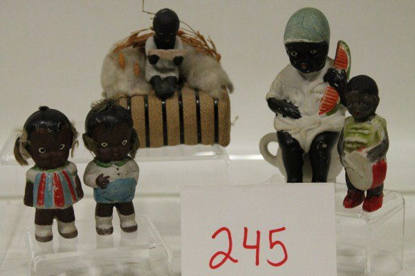 Black Americana Novelty Bisque Group: Black Americana Novelty Bisque Group of 5: pair boy girl dolls; drummer boy; boy with watermelon; boy on cotton bale eating watermelon, tallest 4"