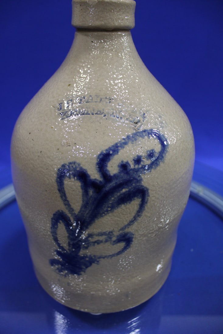 Taft Keene, New Hampshire Gallon Stoneware Jug: Incised J. F. Taft Keene, New Hampshire One-Gallon Stoneware Jug with Cobalt Flourish Decoration, cylindrical jug with sloped shoulder, cobalt-decorated with large abstract floral flourish, 12" H.