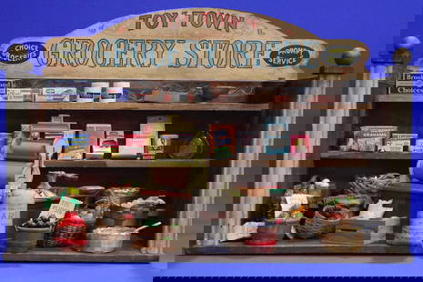 1930s Toy Town Grocery Store: Ca 1930s Toy Town Grocery Store - wood construction, includes angled counter; paper roller with paper, miniature eggs in basket; multiple grocery samples; baskets with produce; feed sacks; metal