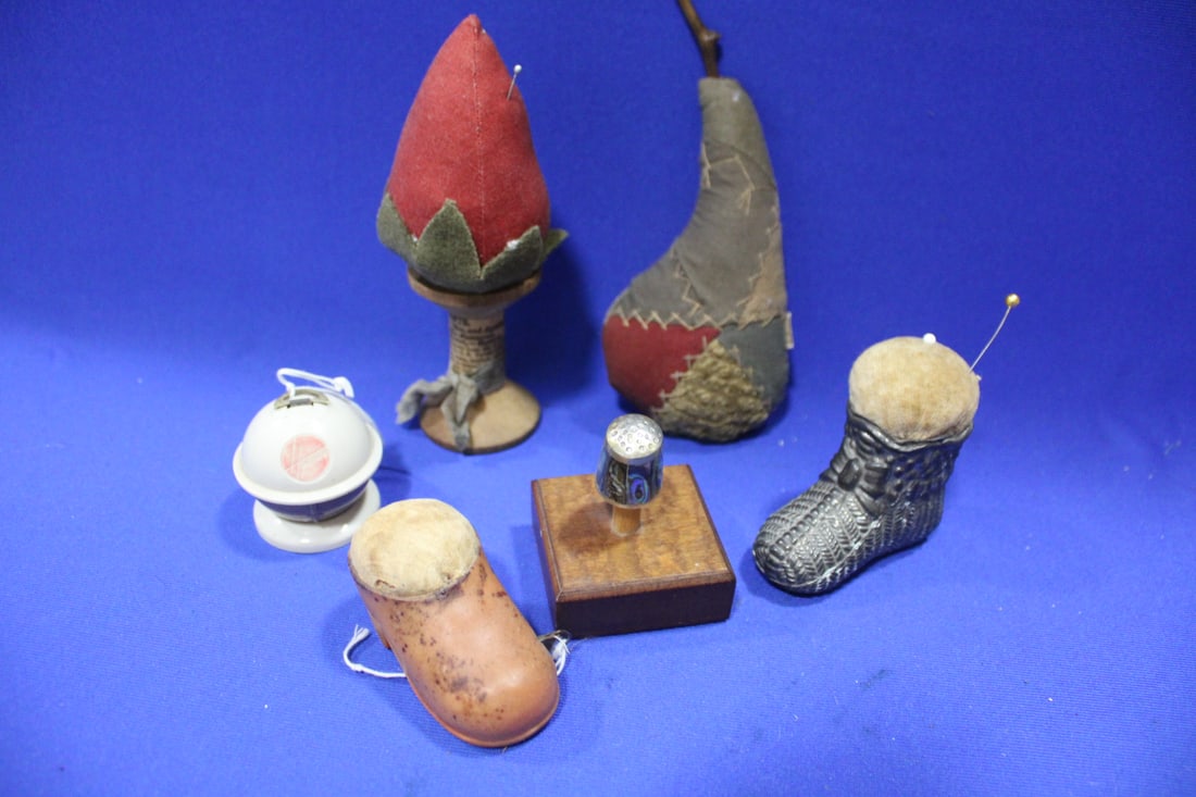 Sewing Lot of Pincushions, Tape Measures & More: Sewing Lot of Pincushions, Tape Measures & More - marked Mexico thimble with abalone inlay; patented emery / pincushion mounted on spool with patent details, 6" H.