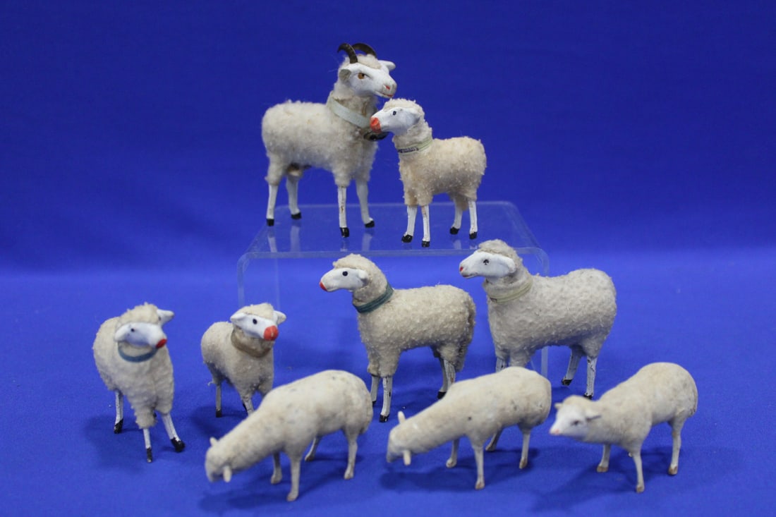 Christmas Putz Stick Leg Sheep Inc. Ram: Lot of 9 Christmas Putz Stick Leg Sheep - large ram with metal horns and bell, 3 1/2" H, each with collars, some with faux wool, 3 composition, Germany, condition.