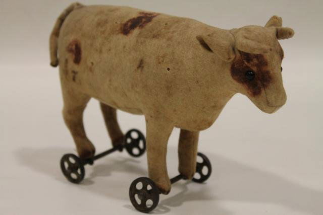 steiff cow on wheels