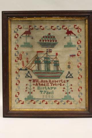 1886 Ship Needlework Sampler: 11 years of age, trees, house, flags, more, red green and navy colors, 17 3/4" x 20 1/2".
