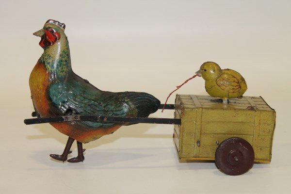 Hans Eberl Tin Wind-Up Hen with Chick: Hen with chick in crate, chick bobs up and down, lithographed, made in Germany, 10 L x 5 H