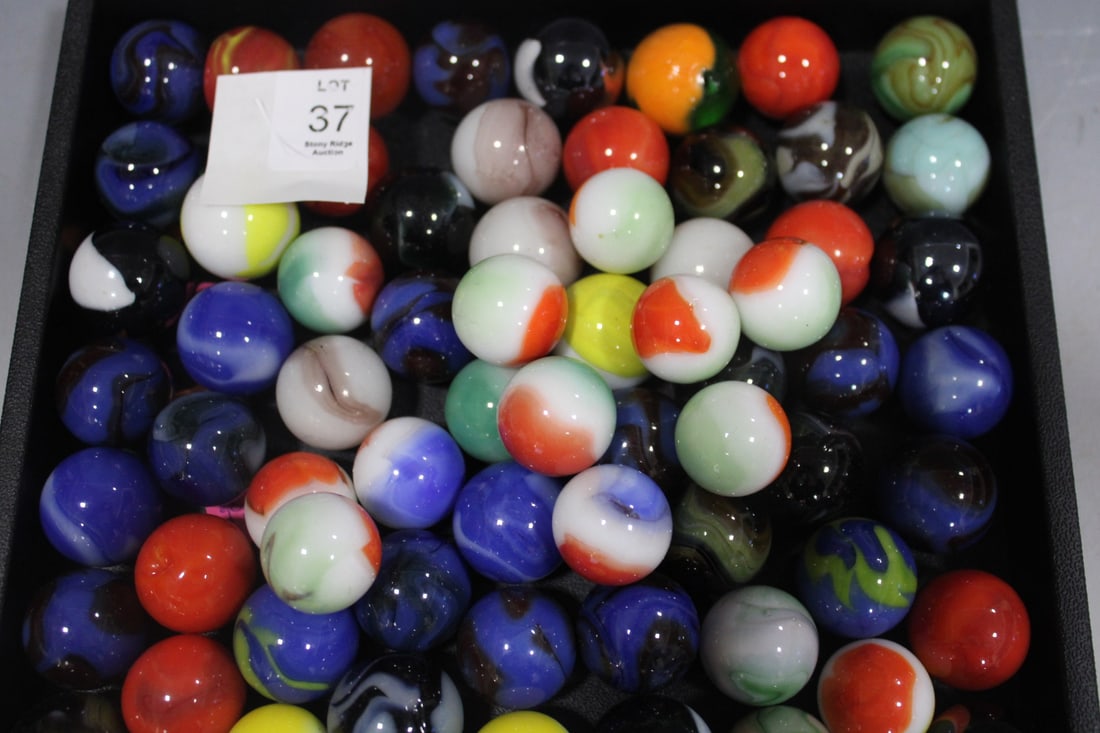 Large Group of Collectible Marble Shooters: Tentatively identified as per labels attached. - Each appx 1" - Bumble bee; Jabo Contact; Transition Bubble; Yellow Agate; Trilite; Tiger; Vacor Cricket and Wicked Owl; Mint Alley; Alley Bacon; Banded