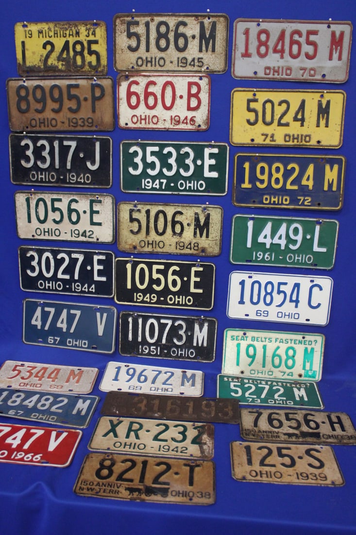 28 Ohio Automobile License Plates 1919-1974: 1919; 1934; 1938; 1939; 1939; 1940; 1942 x 2; 1944; 1945; 1946; 1947 x 2; 1948; 1949; 1951; 1961; 1966; 1967 x 2; 1968; 1969 x 2; 1970; 1971; 1972; 1973; 1974, all well used.
