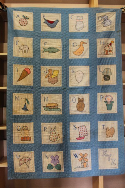 ABC Crib Baby Quilt: ABC crib quilt, hand quilted, embroidery stitching, stitched appliques, approximately 40" W x 60" H.