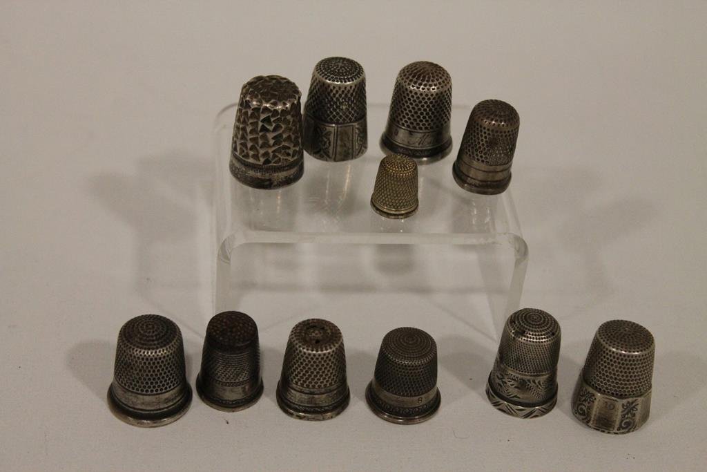Group of Thimbles: 11 thimbles including sterling.