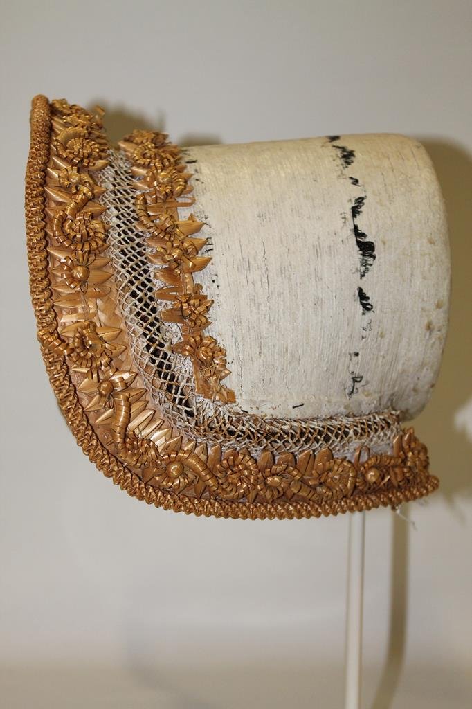 Mid to Early 1800s Bonnet with Paper Mache: Mid to early 1800s poke bonnet with curled straw decoration on a paper mache molded frame, formerly property of Metropolitan Museum of Art NY, one of 50 hats and bonnets selling in auction.