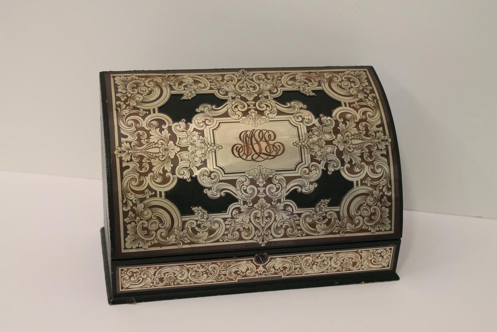 Victorian Letterbox: "Black Starr and Frost" Victorian letterbox with decorative metal plate covers over paper covered wooden box, fabric lined interior has slots for stationery and letter writing implements, working lock