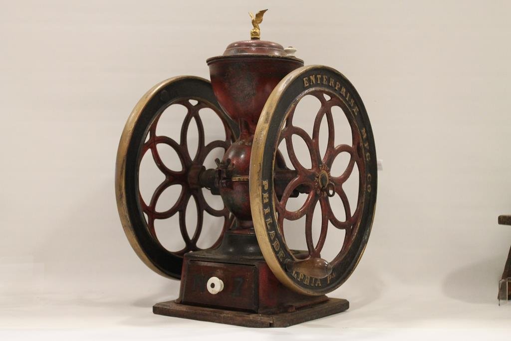 No. 7 Enterprise Store Coffee Mill / Grinder: 1870s store countertop coffee grinder / mill, Enterprise Mfg. Co. red polychrome painted No. 7, Philadelphia, tightening key on right wheel, pat'd date 1873, decals, single drawer with porcelain knob 