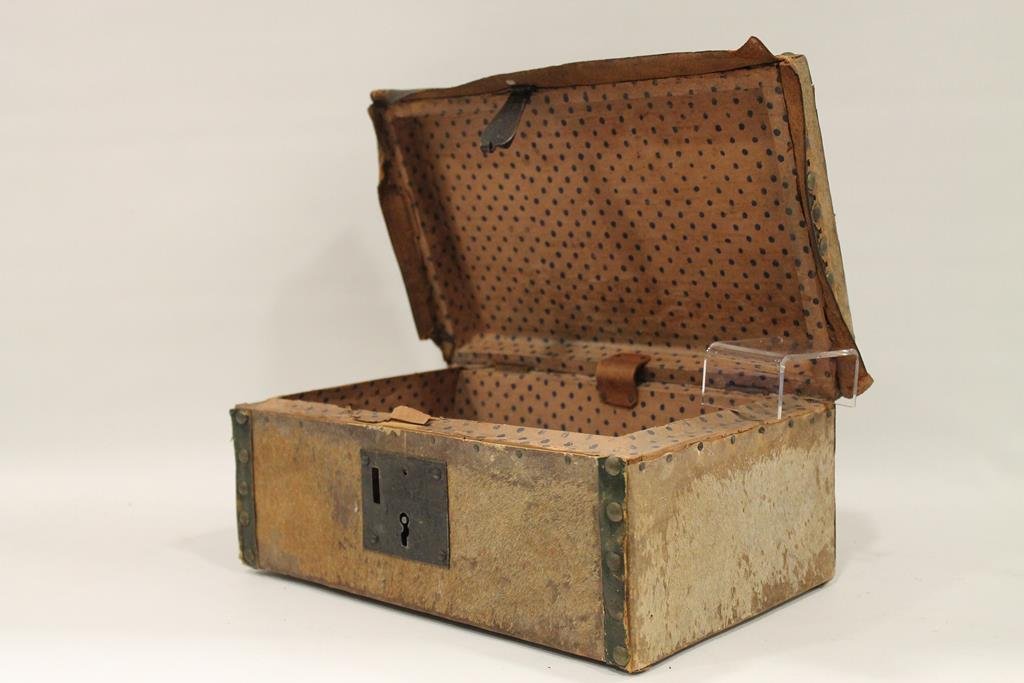Early 1800s Hide-Covered Document Box: 1840-50s hide-covered and brass tack decorated document box, polka-dot wallpaper interior, leather handle, 12 L.