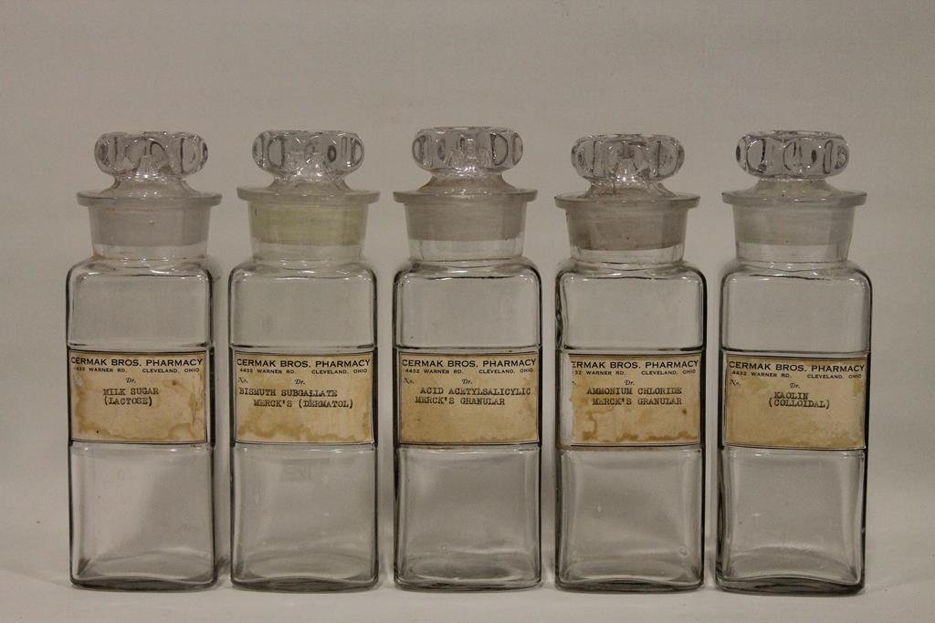 Set of 5 Apothecary Jars Cleveland Pharmacy: Five apothecary jars with ground lids and original paper labels from the Cermak Pharmacy, Cleveland, 8 1/2 H.
