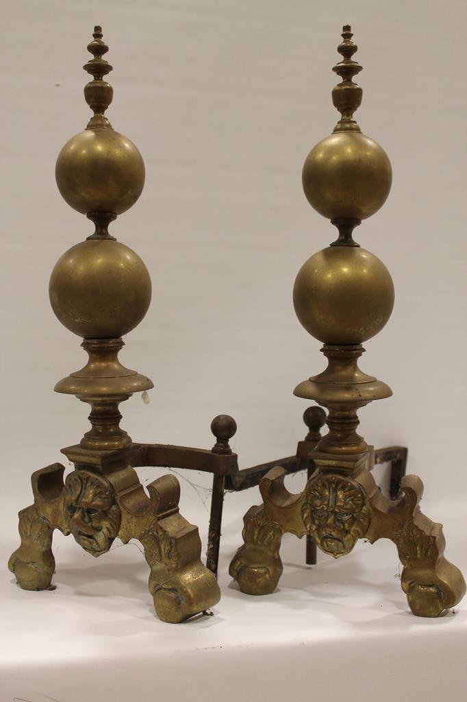 Pair Brass Andirons w/ Lion Heads: Pair spear and sphere form brass andirons with lion crests.