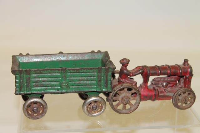 Ferguson Style Red CI Tractor & Wagon: Ferguson-style cast iron red tractor, 3 1/2" L; green cast iron hay wagon,