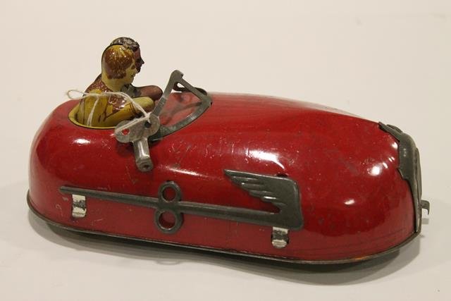 Lindstrom Skeeter Bug Bumper Car: Lindstrom "Skeeter Bug" red painted bumper car with couple in front seat, tin wind-up, 9" L.
