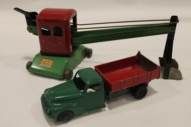 Wyandotte Super-Shovel & Hubley Truck: Wyandotte Toys Super-Shovel pressed steel, good decal wooden wheels, cab - 5 1/2" H; Hubley Kiddie Toy die cast Ford dump truck with swing tailgate, level dump release, 9" L.
