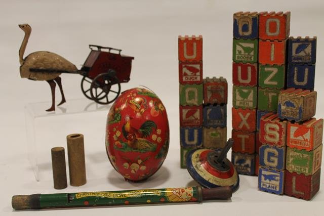 Christmas Tree Magic Whistle & Toys: 1930s Christmas Tree Grove Magic Whistle, clown lithographed slide whistle, Made in USA, 10 1/2' L; German paper mache Easter egg; set interlocking blocks; Lehman tin ostrich "Africa" bank, Made in Ge