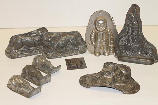 Easter Candy Molds High Wheel Bicycles: Easter rabbit candy molds - rabbits on bicycles, one high wheeler, 5 3/4" H, two-wheel bike, 5" H; running Easter rabbit, 5" L; Indian Chief head single form candy mold, 2 1/4: H; 3 matching single fo