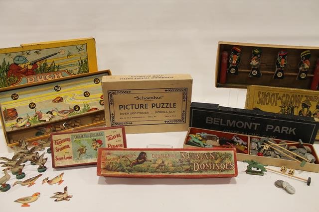 1900-20s Games: All in original boxes: early 1900s Nubian Dominoes; Shoot a Crow Target Game litho paper on wood; Schoenhut Picture Puzzle; Belmont Park Horse Racing Game, No 912; 1911 Pirate & Traveler Spinner Game;