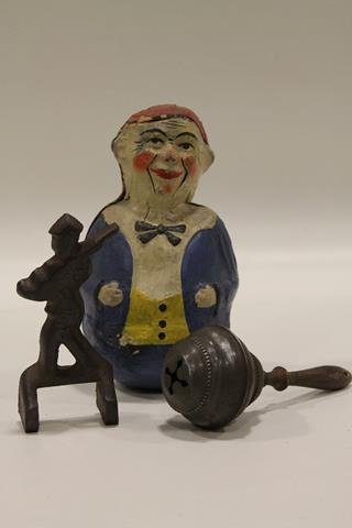 19th C Paper Mache Roly Poly Clown & More: Late 19th century clown, hand-painted, 7 1/2" H.; silverplated baby rattle; cast iron W.F.M. Co, soldier, 5 1/2: H.