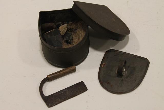 1800s Flints & Steel Striker in Tin Box: Handled flint steel striker, several hard stones / flints, all rests on nest of hair, tin box with interior and exterior lids, 3 1/2" D.