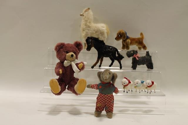 Misc Group of Plush Animals: Steiff dog, 6" L; faux fur teddy bear, 9" H; mohair elephant in cloth costume, 6" H; Occ. Japan squeaker dog, 4" L; real fur llama with leather legs, ears, 7" H; real fur horse, 5" H.