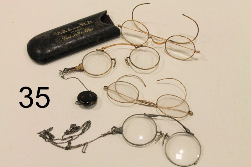 4 Pair Gold-Filled Spectacles: One pair with case marked Greiner MD Pemberville Ohio, 2 with retractable chains, one with silver chain.