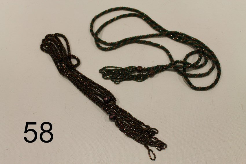 1920s Flapper Sautoir Beaded Necklaces: 2 sautoir necklaces with tassels - gold iridescent beads, 63" L; green and gold iridescent - 66" L.