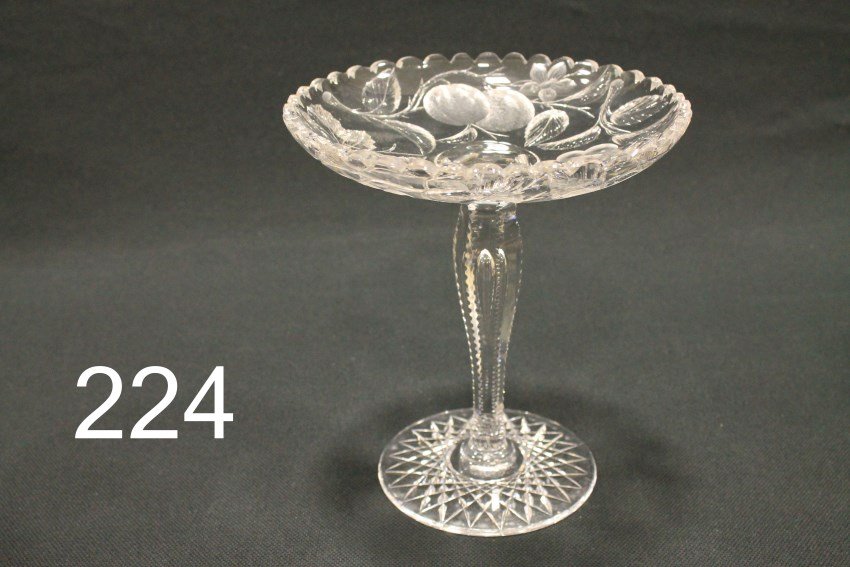 American Brilliant Period Cut Glass Compote with: American brilliant period cut glass compote, notched stem with teardrop, 8 3/4" H x 7 3/4" W. Excellent condition, no visible defects found. . All 62 lots of cut glass selling in this auction belonged