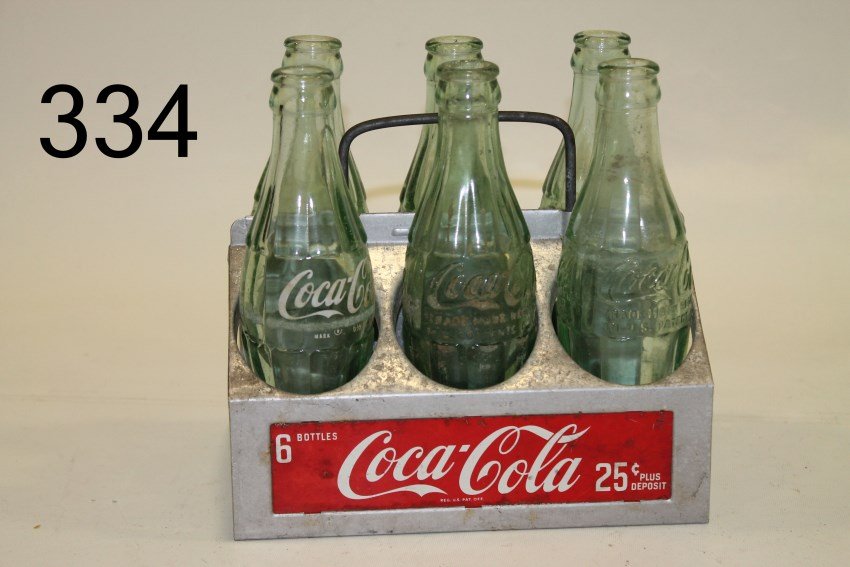 Coca-Cola Metal Bottle Carrier w/ Bottles: Coca Cola metal bottle carrier with 6 Coke bottles.