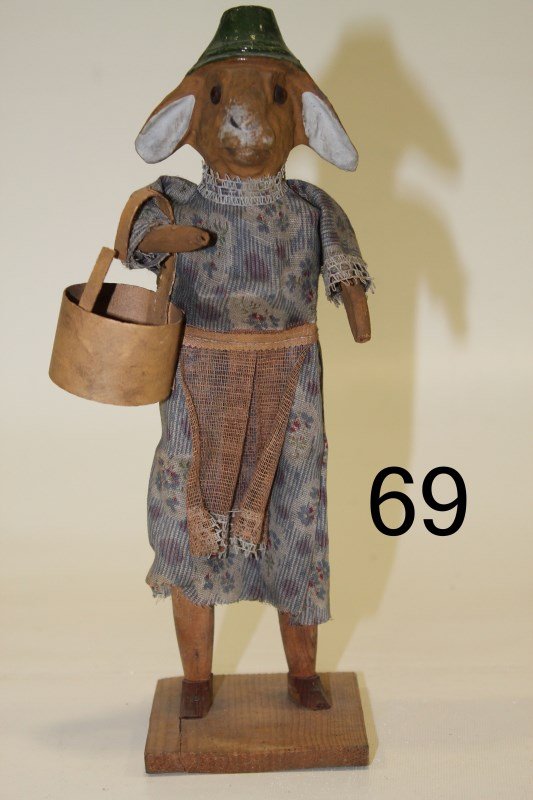 Easter Rabbit Candy Container Squeaker: Carved wood and paper mache Mrs. Easter Bunny carrying candy container basket, press her chest squeaker, cloth dress and apron, 10" H.