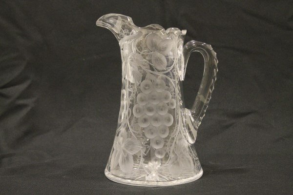 American Brilliant Cut Glass Pitcher - Pairpoint: American brilliant period cut glass pitcher, Pairpoint "Vintage" pattern, triple cut handle, star bottom, heat check on top of handle where is attaches pitcher, 10 1/2" H