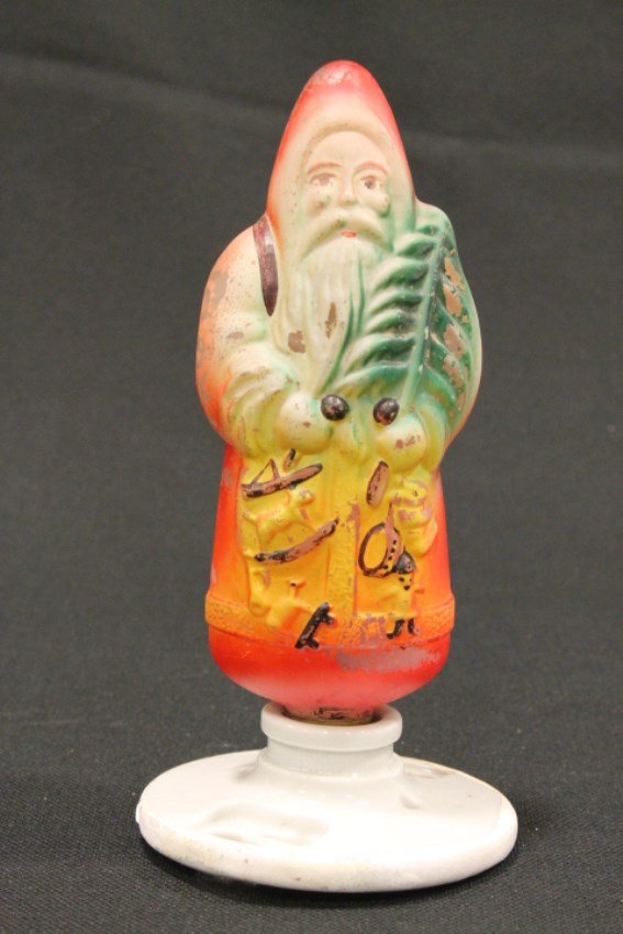 Santa Christmas Tree Edison Light Bulb: Santa Christmas Edison Light bulb, Japan, porcelain base holds glass Santa Claus light bulb, untested. 8" H.