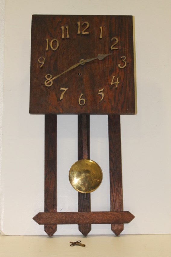 Arts & Crafts Mission-Style Ingraham Wall Clock: Arts& Crafts Ingraham Mission-style oak wall clock, raised brass numerals, Impressed Ingraham on reverse, key & pendulum.