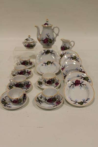 Child's Toy Tea Set - Victorian: White with cranberry and green leaves - 6 cups, 6 saucers, 6 bowls, 2 plates, creamer, lidded sugar bowl, lidded teapot, 5" H. Condition - good.