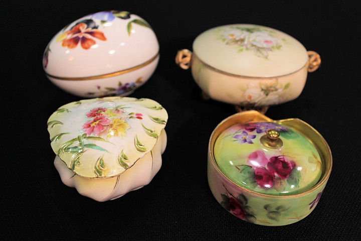 Group of 4 Dresser Boxes: Lidded powder jar marked Royal Bayreuth; tri-cornered lidded box unmarked; egg form marked Limoges; small round lidded box marked Bavaria.
