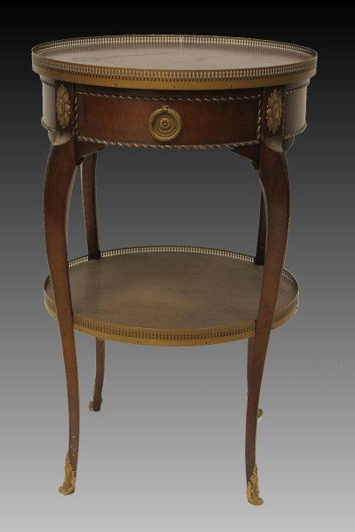 Mahogany Side Table: Brass ormolu banding, feet and medallions, drawer, 18" round x 29" H.