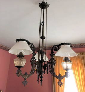 Rare Form Cast Iron Chandelier w/ Peg Lamps: Rare form Victorian cast iron chandelier, 3-arm peg lamps, shades are held in place by cast iron brackets at the top of the shades, all original, not electrified, all matching fonts and shades, and or