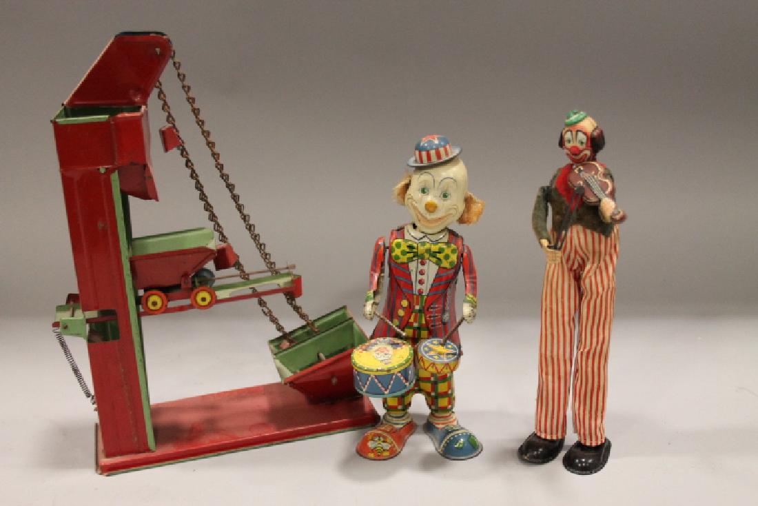 Tin Wind-Up Toy Clowns & Sand Mover Toy: Tin wind-up clowns - one plays violin and other plays drums and sand mover toy.