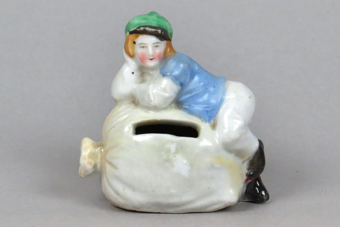 Ceramic Boy on Money Sack Bank (1 of 3)